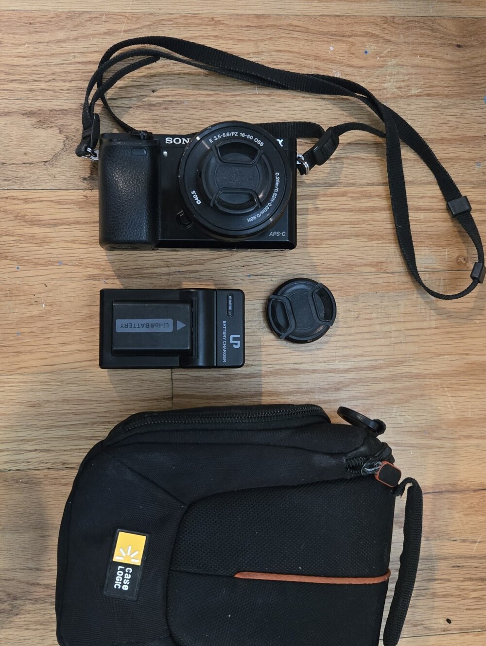 Sony Black Compact Mirrorless Camera with Black Case and Charger